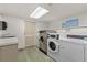 Clean laundry room with washers, dryers, sink and counter, for convenient community use at 3325 Bayshore Blvd # C36, Tampa, FL 33629
