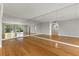 Spacious living room featuring wood floors and large mirrored wall at 3325 Bayshore Blvd # C36, Tampa, FL 33629