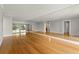 Open living room featuring wood floors and large mirrors at 3325 Bayshore Blvd # C36, Tampa, FL 33629