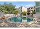 Community pool surrounded by brick pavers and lounge chairs, inviting relaxation and leisure at 3325 Bayshore Blvd # C36, Tampa, FL 33629