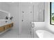 Bathroom featuring a modern vanity, glass shower, and a freestanding tub at 3344 Lagoy St, North Port, FL 34291