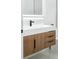 Close-up of bathroom vanity with wood drawers, matte black faucet, and sleek design at 3344 Lagoy St, North Port, FL 34291