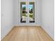 Bright entryway featuring hard wood floors and a beautiful view of the home's front entrance at 3344 Lagoy St, North Port, FL 34291