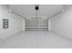 Spacious garage with epoxy flooring and overhead storage at 3344 Lagoy St, North Port, FL 34291