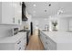 Bright kitchen with white cabinets, stainless steel appliances, and a large island at 3344 Lagoy St, North Port, FL 34291