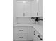 Bright kitchen with white cabinets and modern hardware, providing ample storage at 3344 Lagoy St, North Port, FL 34291