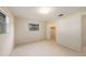 Bedroom with window view, closet, and door, blending comfort and practicality at 3404 Dahlia Pl, Largo, FL 33771