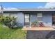 Charming exterior view with a freshly painted blue exterior and well-maintained landscaping at 3404 Dahlia Pl, Largo, FL 33771