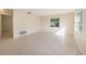 Bright living room with tile flooring and abundant natural light from multiple windows at 3404 Dahlia Pl, Largo, FL 33771
