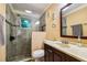 Bathroom features a walk-in shower with glass door, stylish fixtures, and a modern vanity at 3414 Whittier St, Tampa, FL 33619