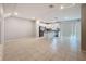 Spacious open-concept kitchen with white cabinets, granite countertops, stainless steel appliances, and a modern island at 34187 Rogallo Ln, Wesley Chapel, FL 33545