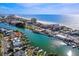 Beautiful aerial view of the beach, water, and condos with ample parking and canals nearby at 4103 Gulf Blvd # 210, St Pete Beach, FL 33706