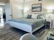 Comfortable bedroom featuring calming paint color, modern lighting, and a closet for storage at 4103 Gulf Blvd # 210, St Pete Beach, FL 33706