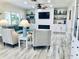 Inviting living room with a modern fireplace, built-in shelves, and stylish seating at 4103 Gulf Blvd # 210, St Pete Beach, FL 33706