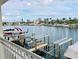 Relaxing view from the water highlighting the boat lifts, docks, water, and surrounding neighborhood at 4103 Gulf Blvd # 210, St Pete Beach, FL 33706