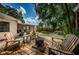 Beautiful backyard features wooden deck with firepit and lounge chairs for entertaining at 4106 W Fielder St, Tampa, FL 33611