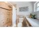 Bathroom featuring tiled shower, toilet and vanity with white countertop at 4106 W Fielder St, Tampa, FL 33611