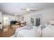 Spacious bedroom featuring a chair, a fluffy rug, French doors and ensuite bathroom at 4106 W Fielder St, Tampa, FL 33611