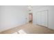 Bedroom featuring tile floors, closet and neutral walls with ample natural light at 4106 W Fielder St, Tampa, FL 33611