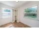Sun-filled bedroom with tiled floor and built in closet and backyard view at 4106 W Fielder St, Tampa, FL 33611