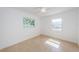 Bedroom featuring tile floors and large windows providing ample sunlight at 4106 W Fielder St, Tampa, FL 33611