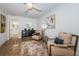 Bedroom featuring two chairs, a fluffy rug, and an ensuite bathroom at 4106 W Fielder St, Tampa, FL 33611