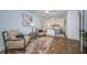 Well-lit bedroom with two chairs and table, ensuite bathroom, and French doors in background at 4106 W Fielder St, Tampa, FL 33611