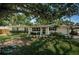 Charming single-story home with a well-maintained lawn, a quaint front porch and established landscaping at 4106 W Fielder St, Tampa, FL 33611