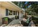 Inviting front porch with seating, swing, and a view of the surrounding neighborhood at 4106 W Fielder St, Tampa, FL 33611