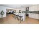 Modern kitchen with white cabinets, stainless steel appliances, and a spacious island for entertaining at 4106 W Fielder St, Tampa, FL 33611