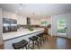 Bright kitchen featuring an eat-in island and stainless steel appliances, ideal for cooking and entertaining at 4106 W Fielder St, Tampa, FL 33611