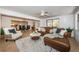 Spacious living room with comfortable seating, a modern rug, and views into the dining area at 4106 W Fielder St, Tampa, FL 33611
