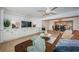 Open-concept living room flowing into the dining area, featuring modern furnishings and natural light at 4106 W Fielder St, Tampa, FL 33611
