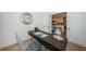 Home office featuring modern desk with view of the kitchen through french doors at 4106 W Fielder St, Tampa, FL 33611