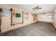 Spacious room with tiled floor, ceiling fans and wall-mounted fishing rod racks at 4106 W Fielder St, Tampa, FL 33611