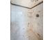 Tiled shower with bench seating and a rainfall showerhead at 4106 W Fielder St, Tampa, FL 33611