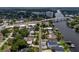 Aerial view of homes along the river, a bridge, and cityscape in the background at 4304 N River View Ave, Tampa, FL 33607