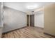 View of a bedroom with wood floors and block wall accents at 4304 N River View Ave, Tampa, FL 33607