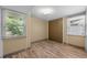 Bedroom with wood-look floors, a closet, and a large window with a view at 4304 N River View Ave, Tampa, FL 33607