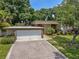 Charming single-story home with a two-car garage and well-manicured landscaping at 4304 N River View Ave, Tampa, FL 33607
