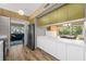 Spacious kitchen featuring white countertops, wood floors, and an open layout to the living and dining areas at 4304 N River View Ave, Tampa, FL 33607
