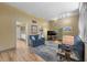 Inviting living room with hardwood floors, stylish furniture, and an open layout leading to the kitchen at 4304 N River View Ave, Tampa, FL 33607