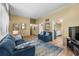 Comfortable living room with wood floors and neutral walls, seamlessly connecting to the home's other spaces at 4304 N River View Ave, Tampa, FL 33607