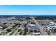 Expansive aerial view of the neighborhood, featuring a busy street, commercial buildings, and residential areas at 4709 Mineola St, Bradenton, FL 34207