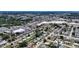 An aerial view showcases the property's location within a vibrant community, close to shopping and green spaces at 4709 Mineola St, Bradenton, FL 34207