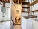 Incomplete bathroom next to laundry area with exposed pipes and utilities at 4709 Mineola St, Bradenton, FL 34207