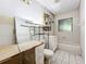 Bathroom featuring tile floors, a vanity, a bathtub with shower, and a window at 4709 Mineola St, Bradenton, FL 34207