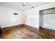 Bedroom featuring wood floors, white walls, ceiling fan, and closet at 4709 Mineola St, Bradenton, FL 34207