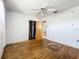 Bedroom featuring hardwood floors, a ceiling fan, and a closet at 4709 Mineola St, Bradenton, FL 34207
