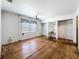 Bedroom showcasing hardwood floors, a ceiling fan, and built-in shelving at 4709 Mineola St, Bradenton, FL 34207